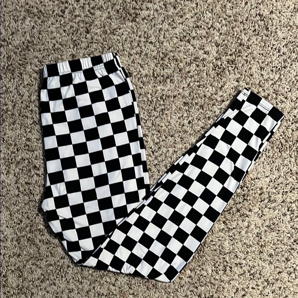 Size is “plus size” black and white checkered print leggings